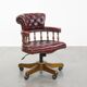 Fauteuil de bureau Chesterfield pivotant classique rouge en cuir de vachette sur roulettes