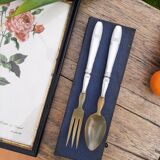 Corn and silver metal salad cutlery