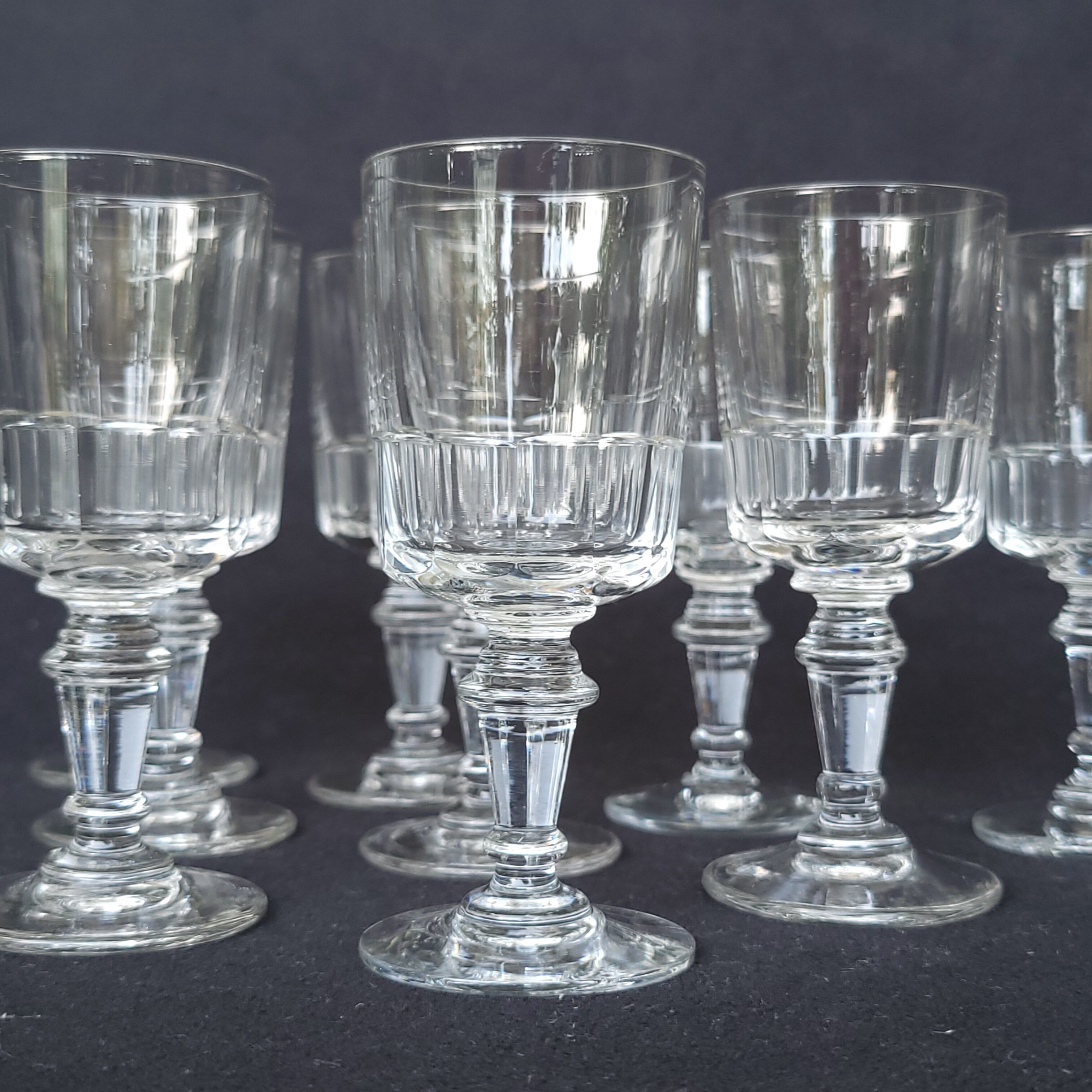 9 old wine glasses or liqueur XIXth in glass cut with 11 sides