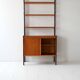 Vintage Scandinavian bookcase with pull-out desk and brass supports