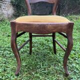 Old wooden chair with upholstered seat