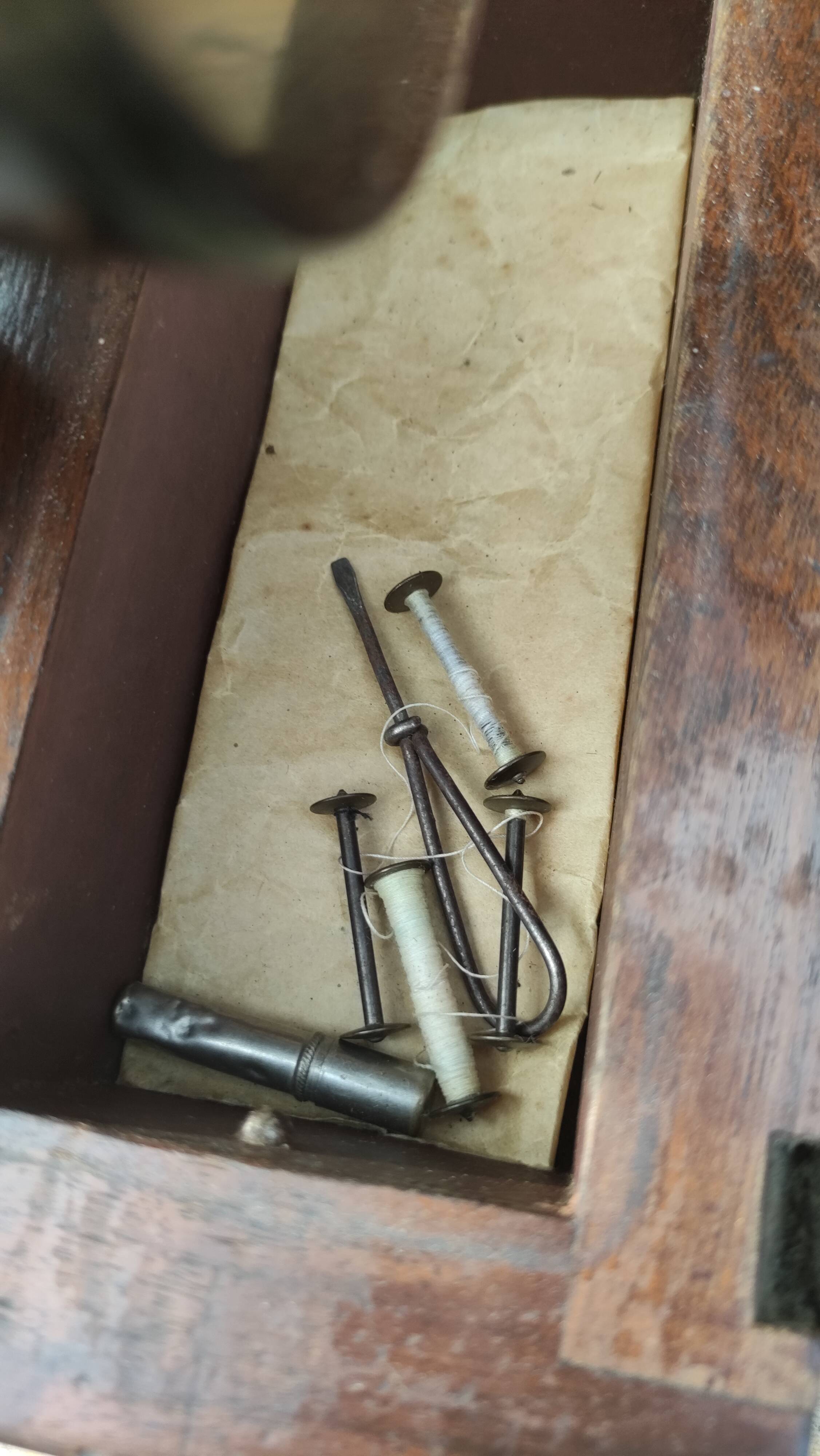 Old Singer sewing machine on its original base