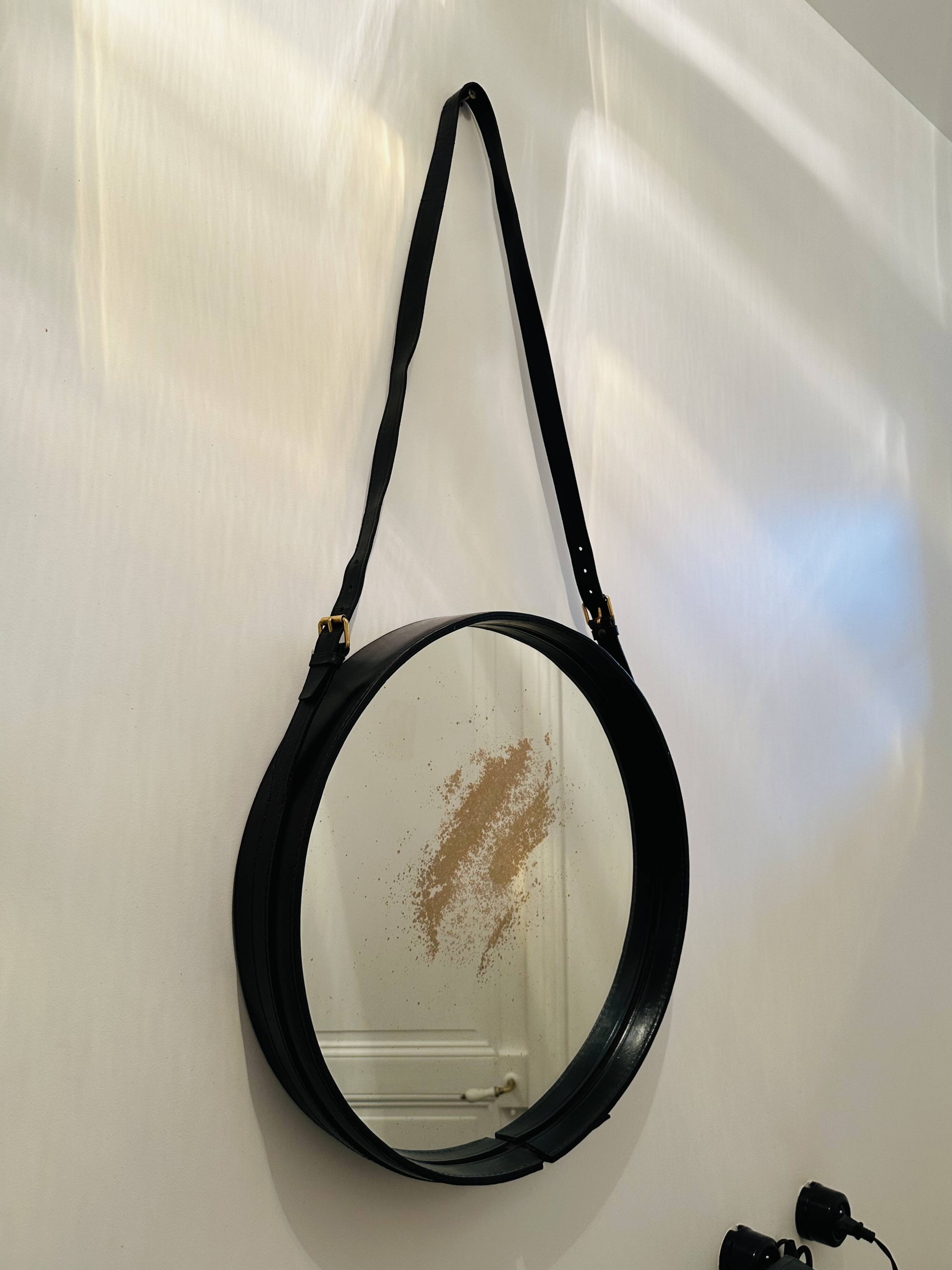 Jacques Adnet pair of circular leather and brass mirrors