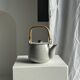 Small Asian stoneware teapot with rattan handle H11 D10