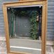 17th century Italian style gilded mirror in carved wood.