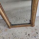 Long wooden mirror and gilded stucco with pearl rays H: 2m45 L: 40cm