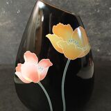 Earthenware vase with stylized flowers on a black background