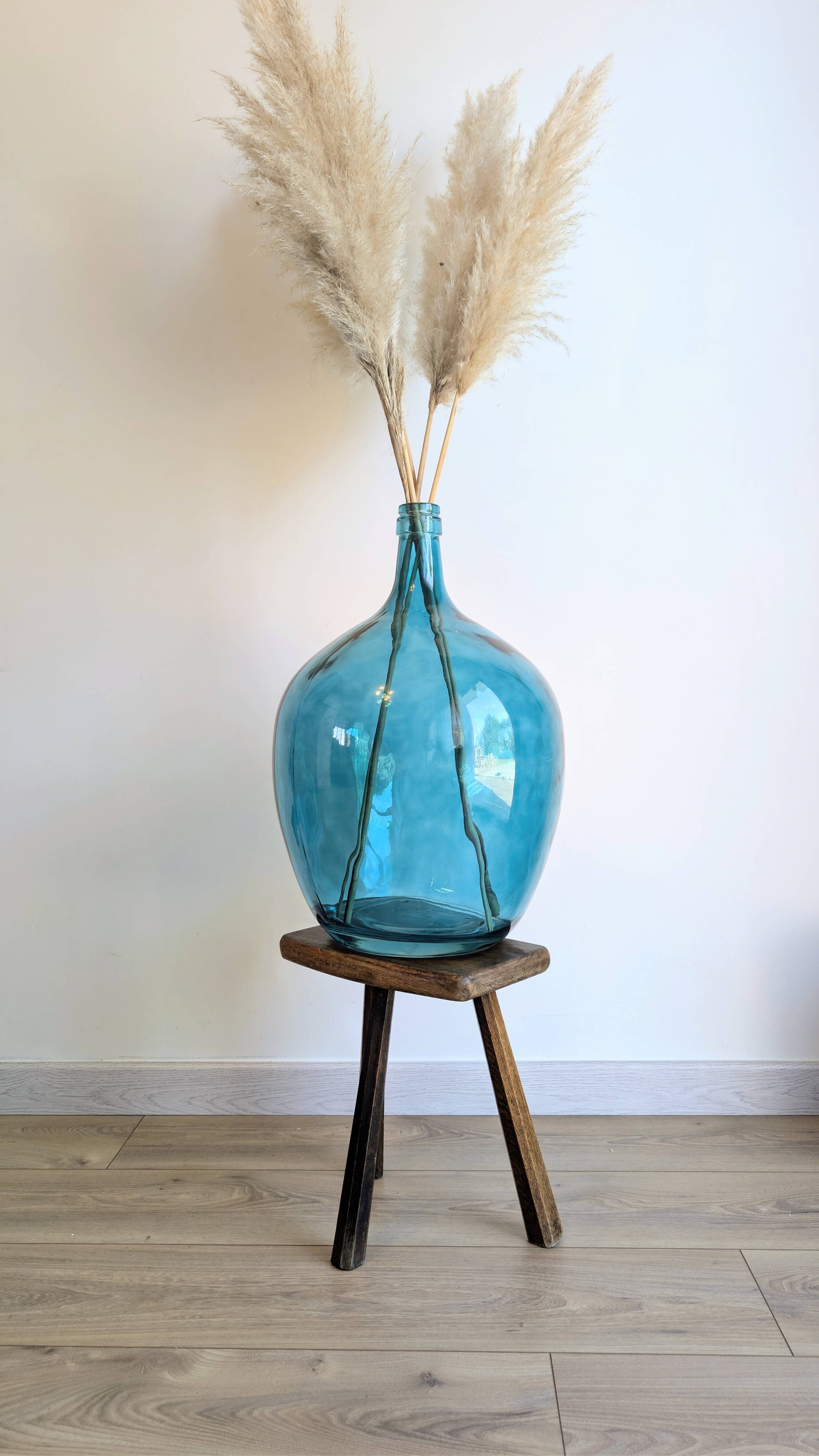 Antique tripod stool in patinated solid wood