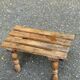 Rustic stool in solid wood with turned legs.