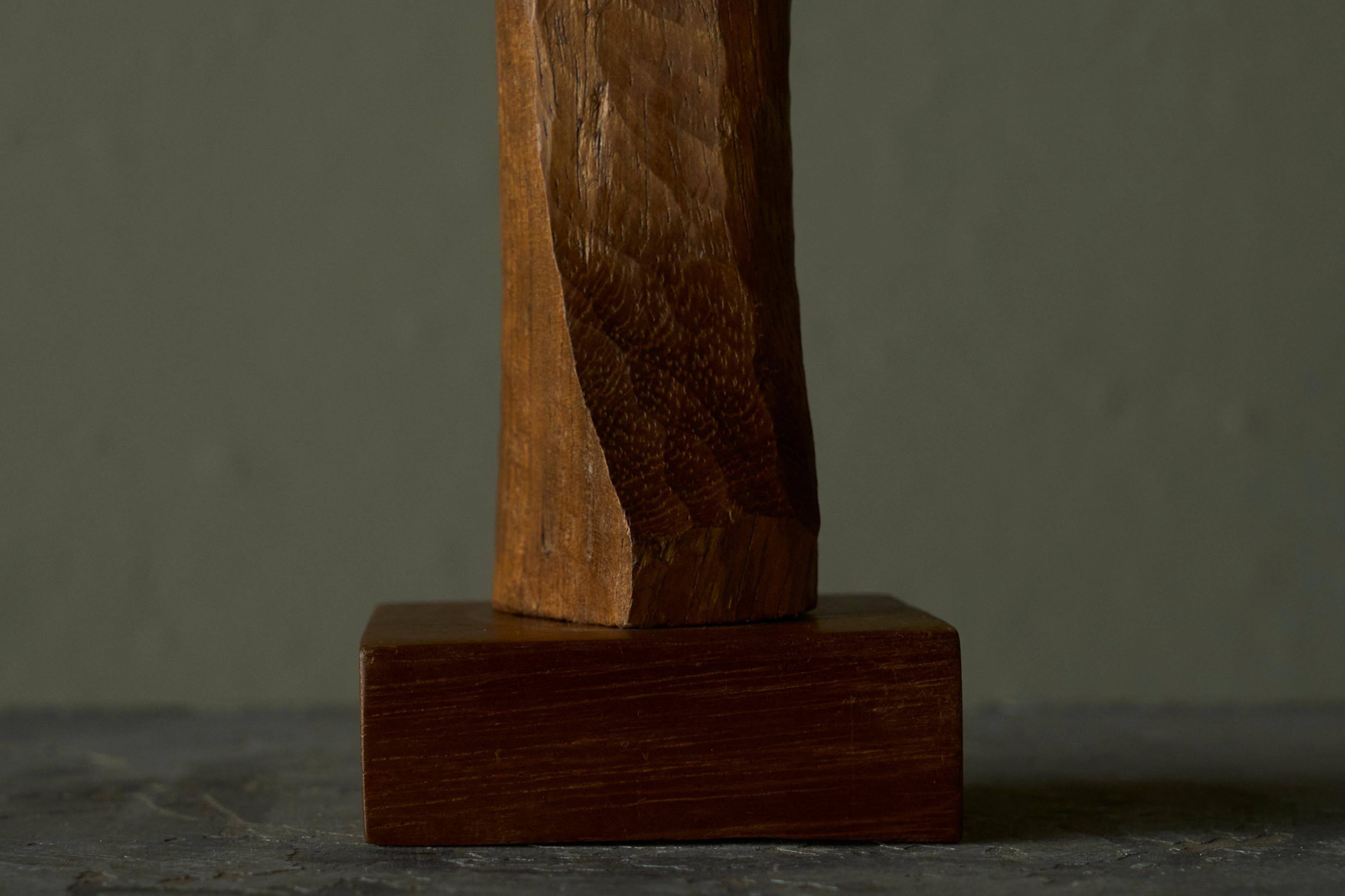 Sculpture of a woman and child in hand-carved wood, mid-20th century.