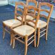 4 solid wood straw-seated Louis Philippe chairs, oak, 20th century.