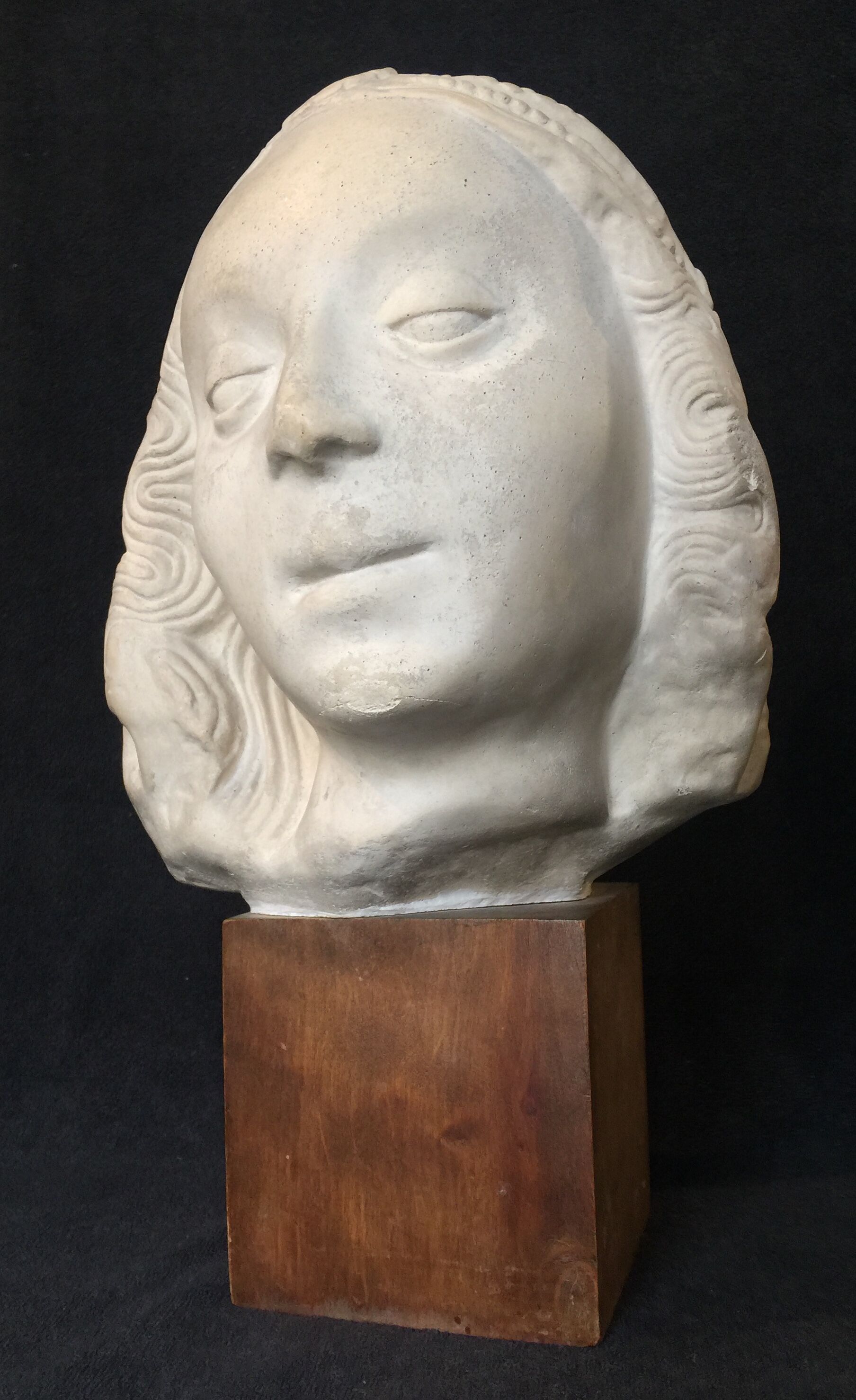 Bronze-middle-aged woman's head in plaster