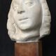 Bronze-middle-aged woman's head in plaster