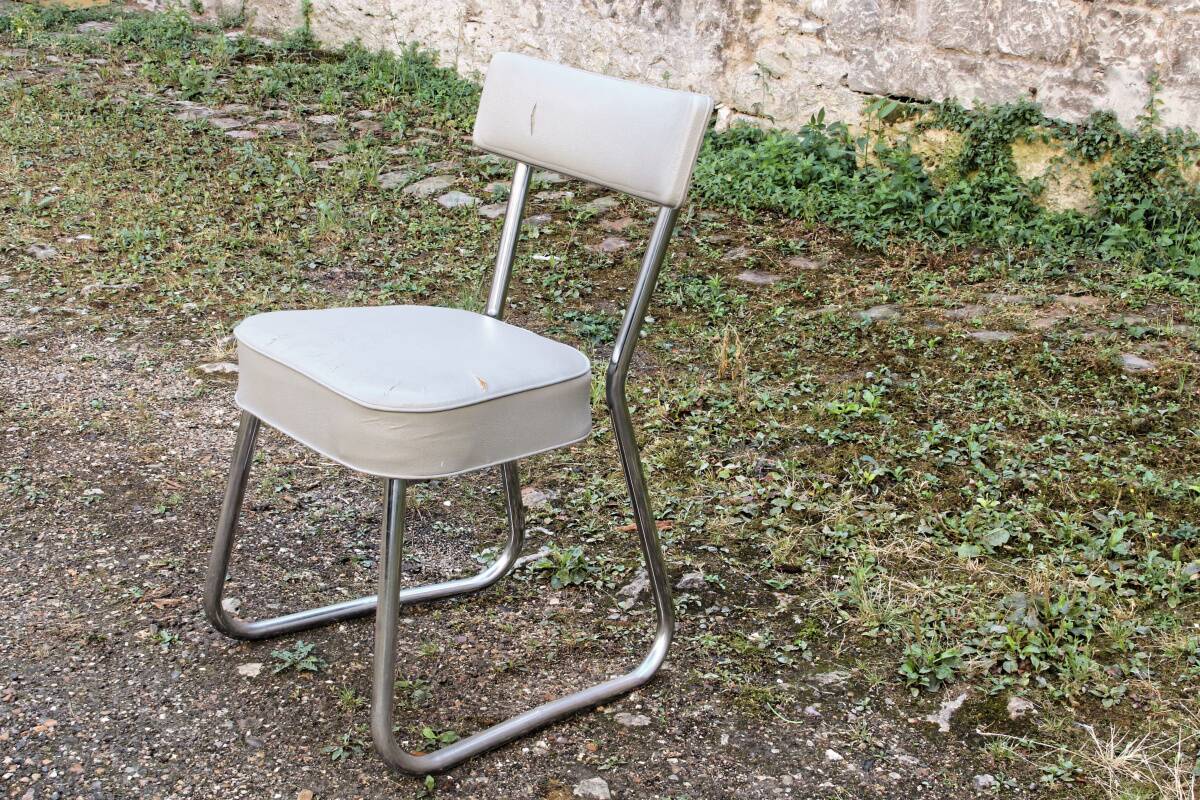 Set of 2 chairs and 1 armchair from the 70s in chrome metal and faux leather.