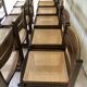 Set of 12 "sledge" dining chairs in walnut and cane.