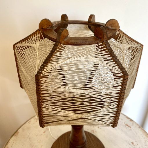 Wooden lamp and stretched wires
