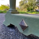 Old table with patinated green legs