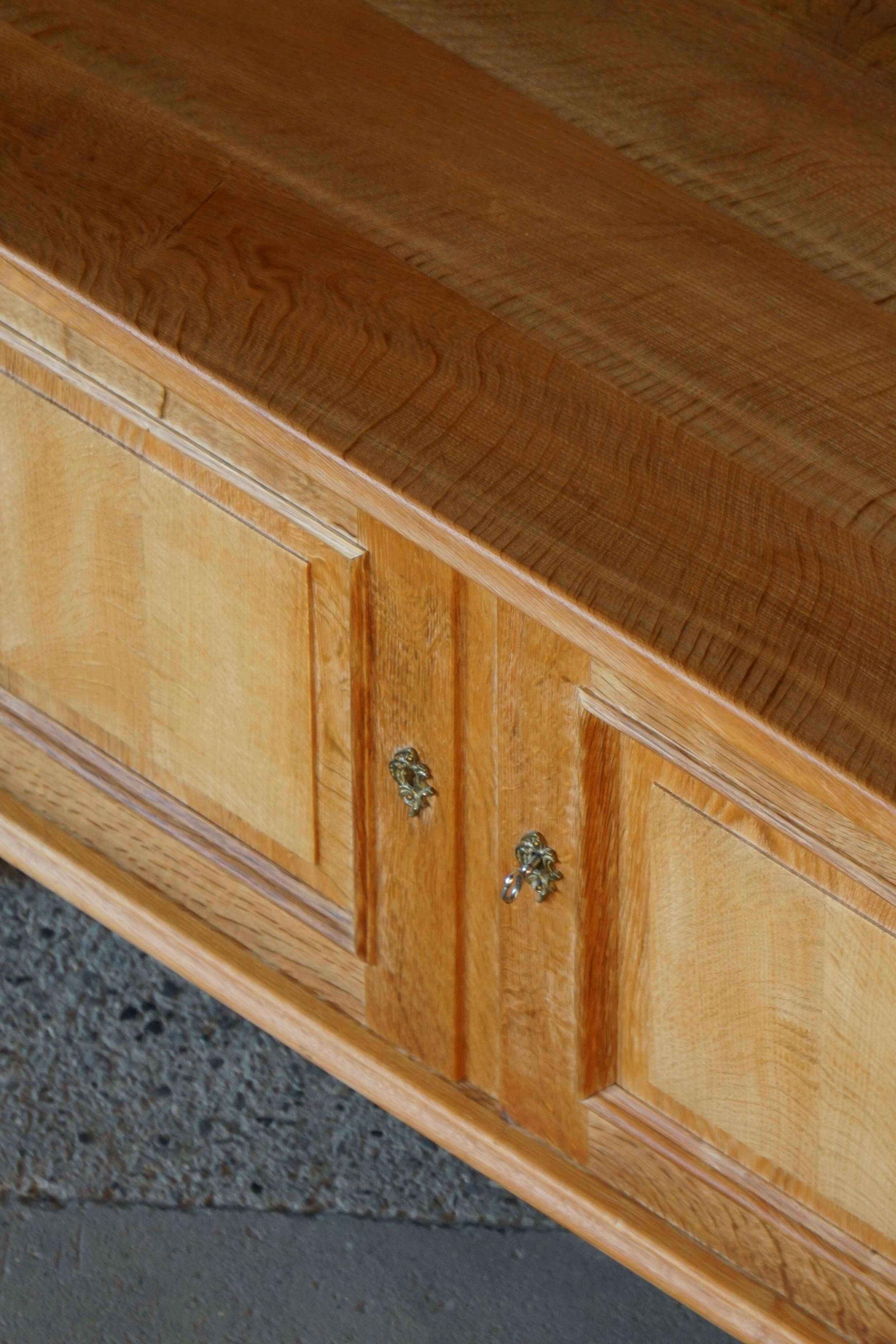 Modern Danish low enfilade in oak with panelled doors, mid-20th century.