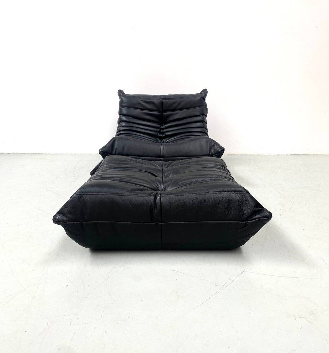 Set of French Togo lounge chair and ottoman in black leather attributed to Michel Ducaroy for Ligne Roset, 1970s