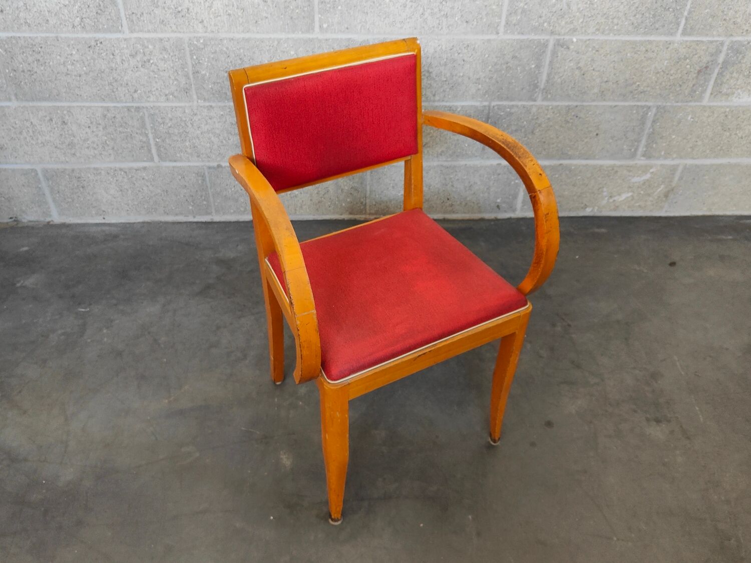 Small red bridge chair with armrests