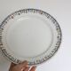 Round dish and flat Terre de Fer, Saint Amandinoise, 1930