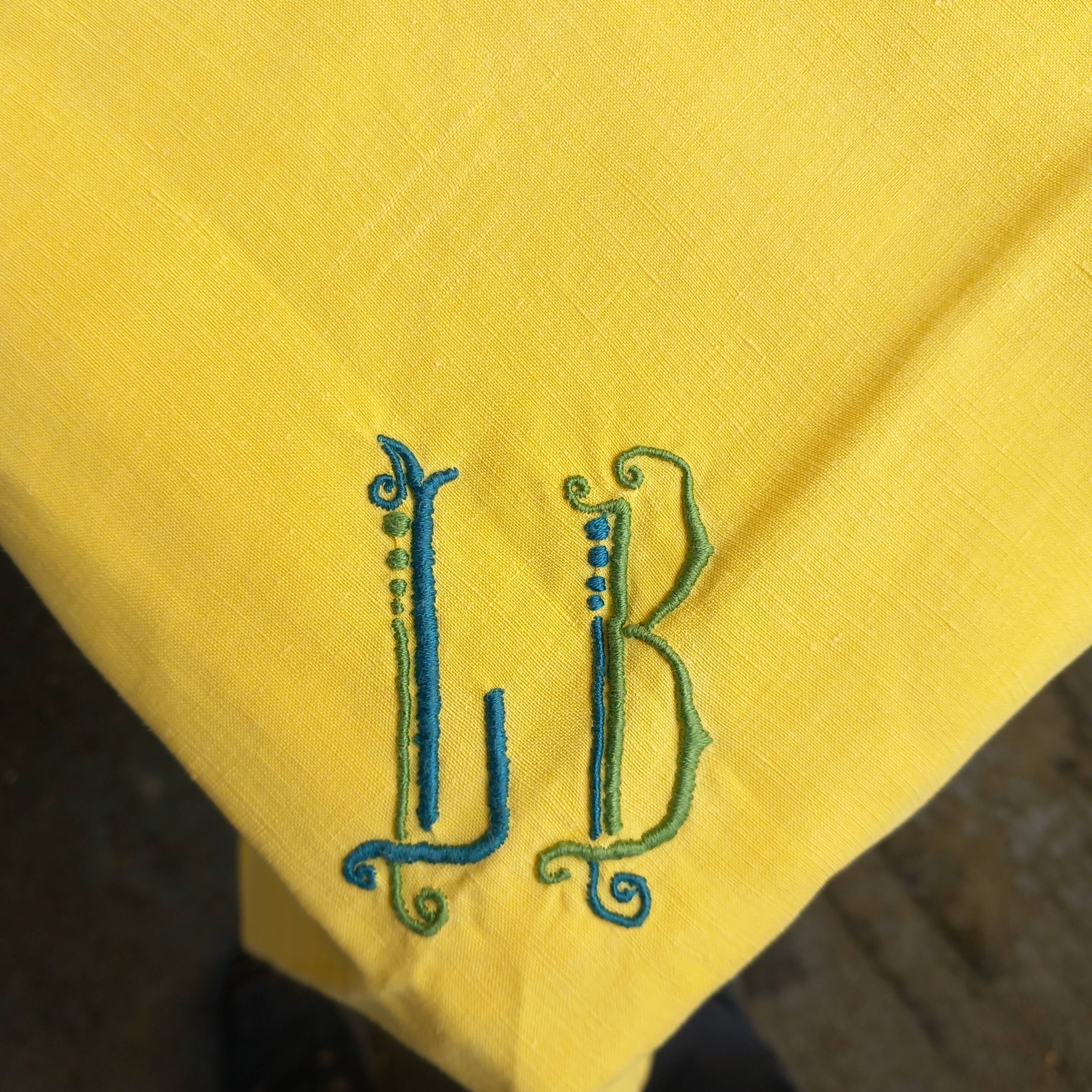Small vintage yellow embroidered tablecloth and 12 napkins.