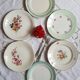 Flat earthenware plates with gilded edges