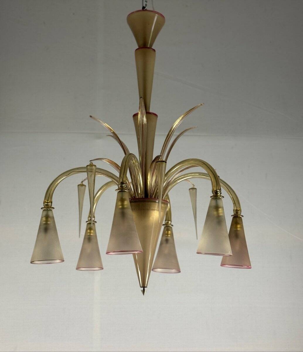 Venetian chandelier in beige/gray murano glass bordered with a red net