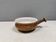 Small ceramic bowl with handle, in golden colours. Danish 1960-70s