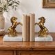 Pair of vintage bookends with rearing horses in gilded metal on marble bases.