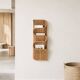Wall-mounted magazine rack TIBY in rattan wicker by Karl Malmvall for Ikea from the 90s.