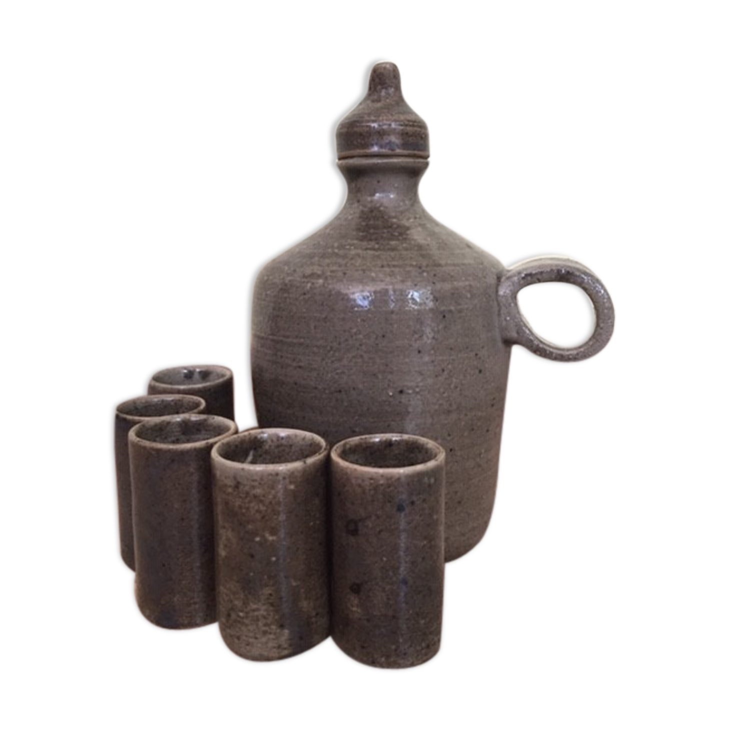 Old liquor service in sandstone, carafe and 5 glasses