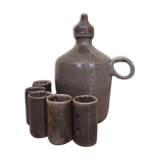 Old liquor service in sandstone, carafe and 5 glasses