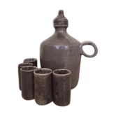 Old liquor service in sandstone, carafe and 5 glasses