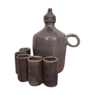 Old liquor service in sandstone, carafe and 5 glasses