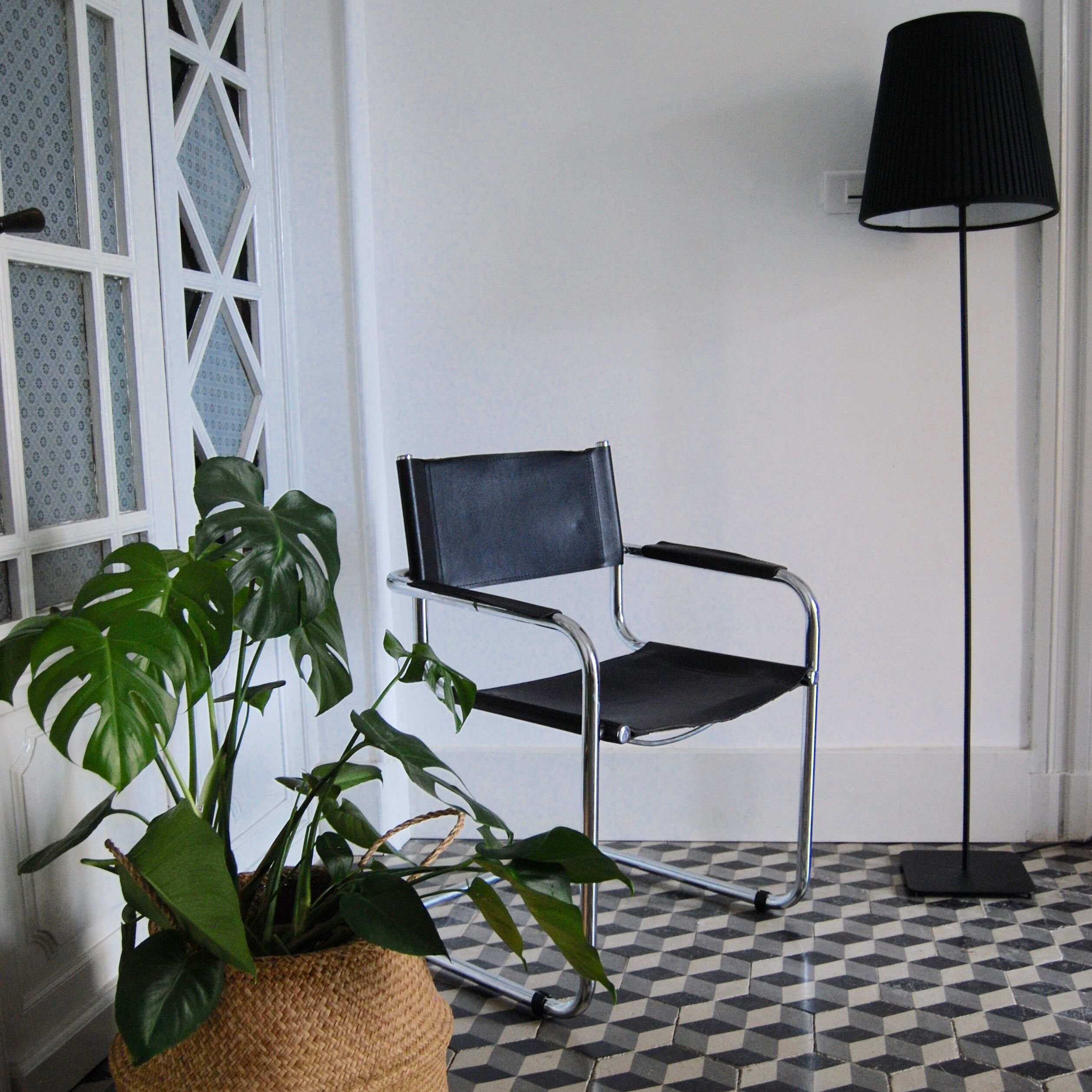 Vintage chrome and faux black leather armchair