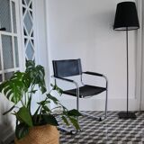 Vintage chrome and faux black leather armchair