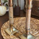 Pair of brass and stone candlesticks