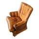 Fauteuil club en cuir de mouton des années 1970 avec porte-revues