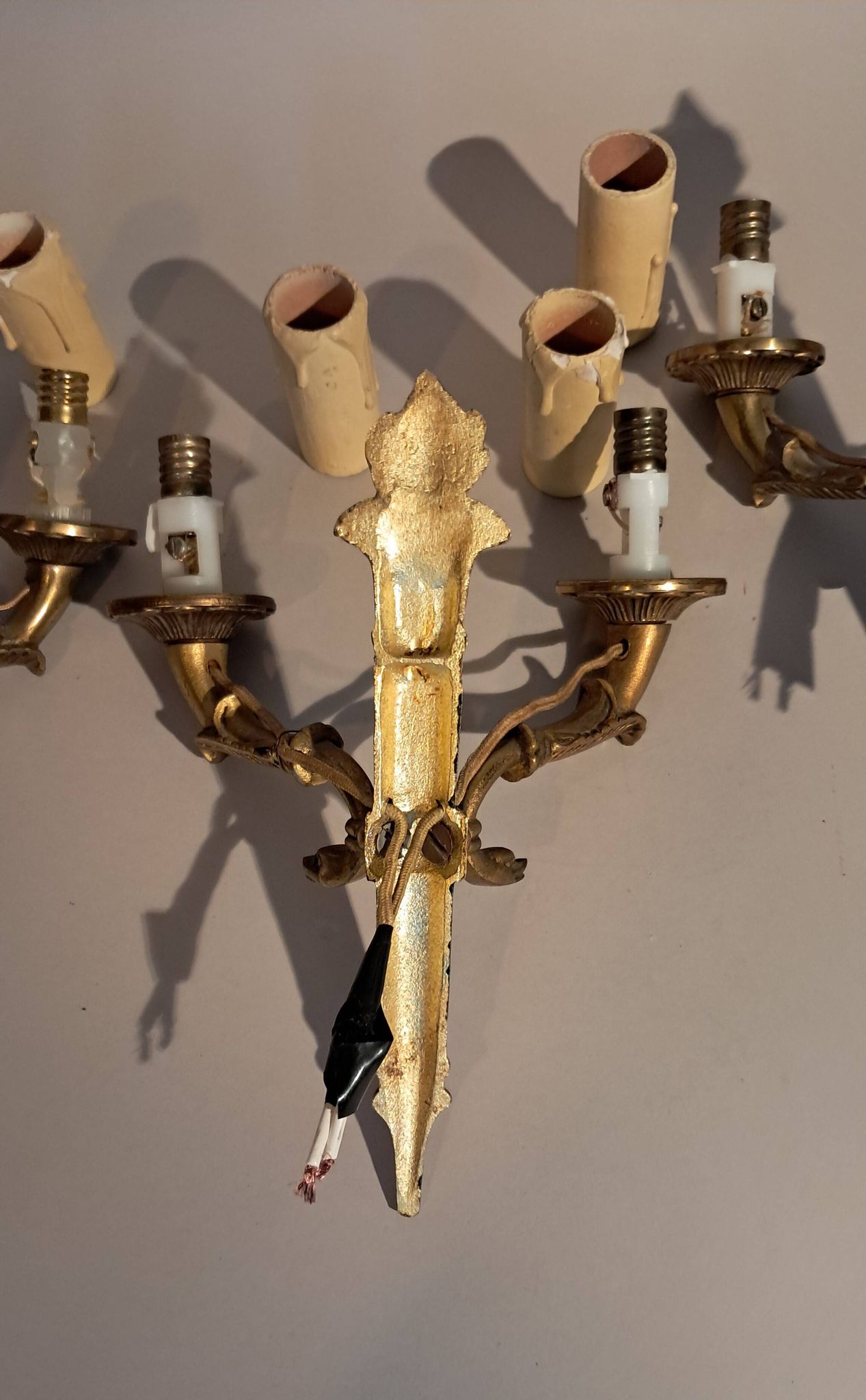 Set of 3 Empire style wall lights in bronze and gilded and green lacquered brass, Circa 1950.
