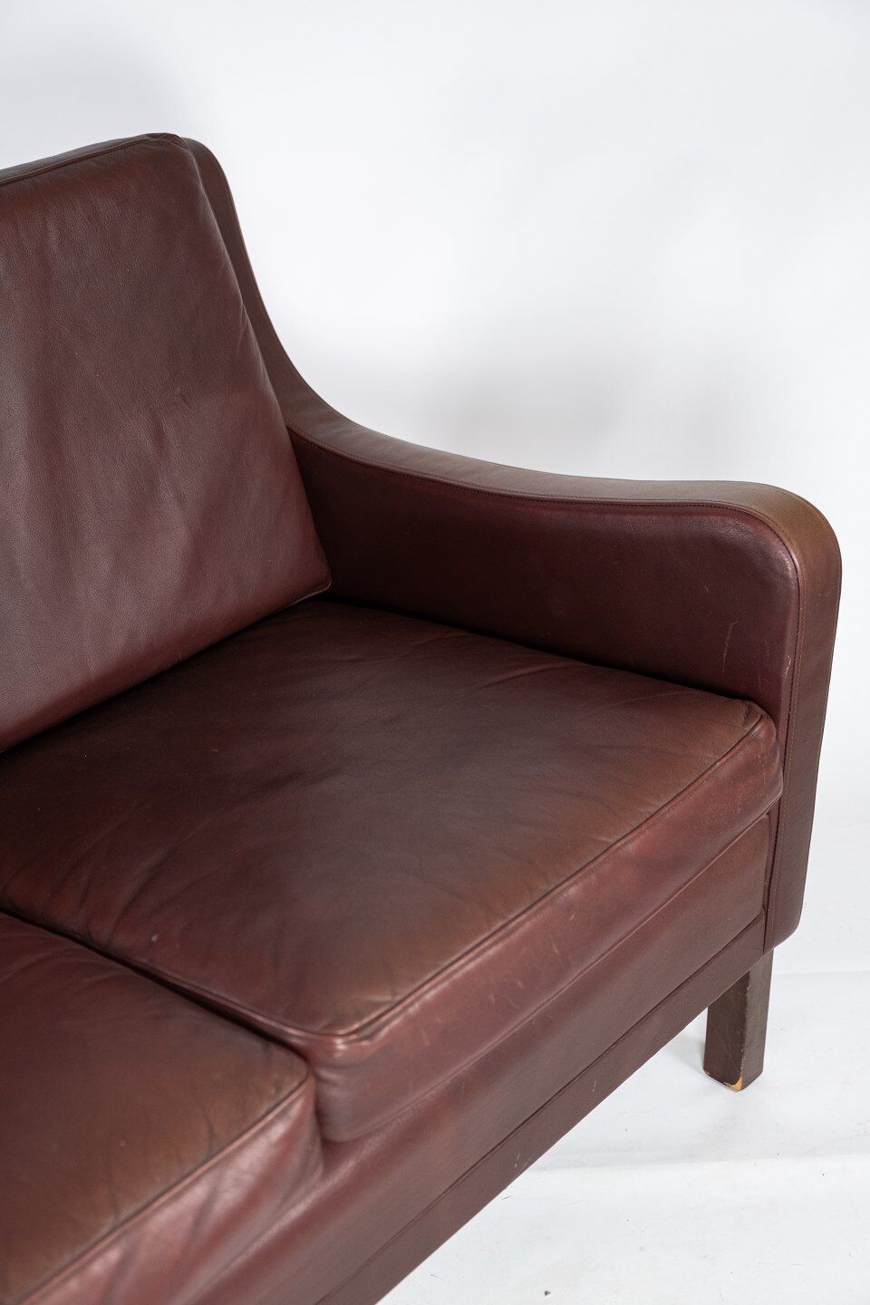 Two seater sofa, with red brown leather by Stouby Furniture
