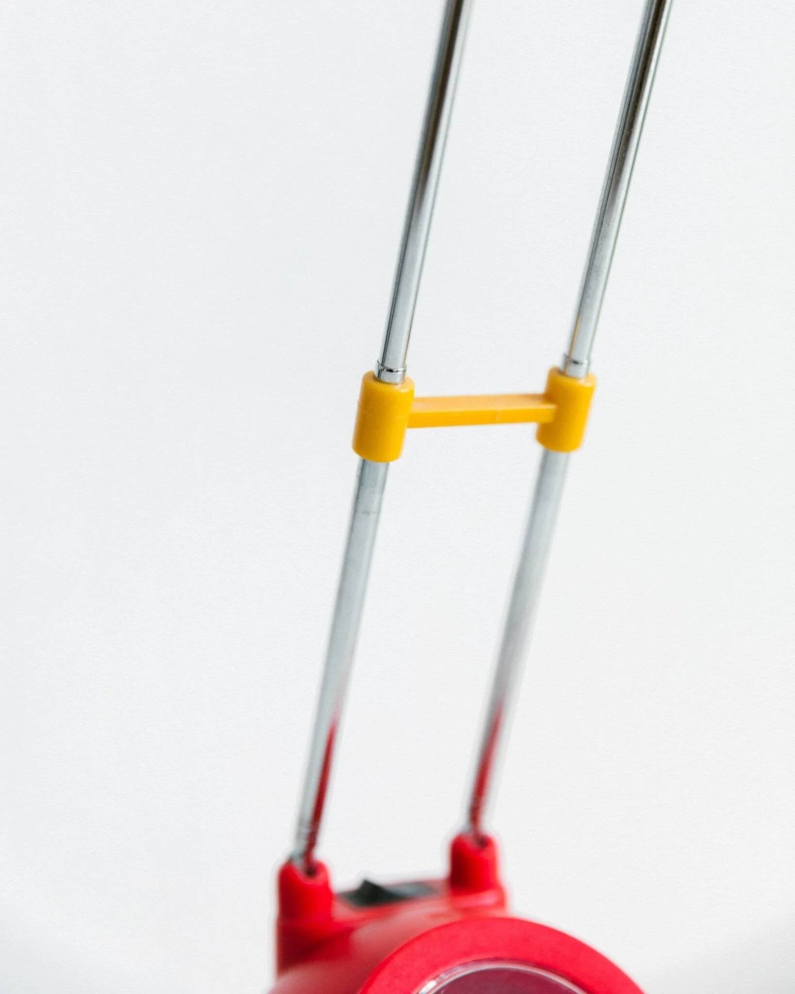 Blue-painted metal shade, chrome articulated arm desk lamp in Memphis-style 80s Pop Art with red base and yellow accents