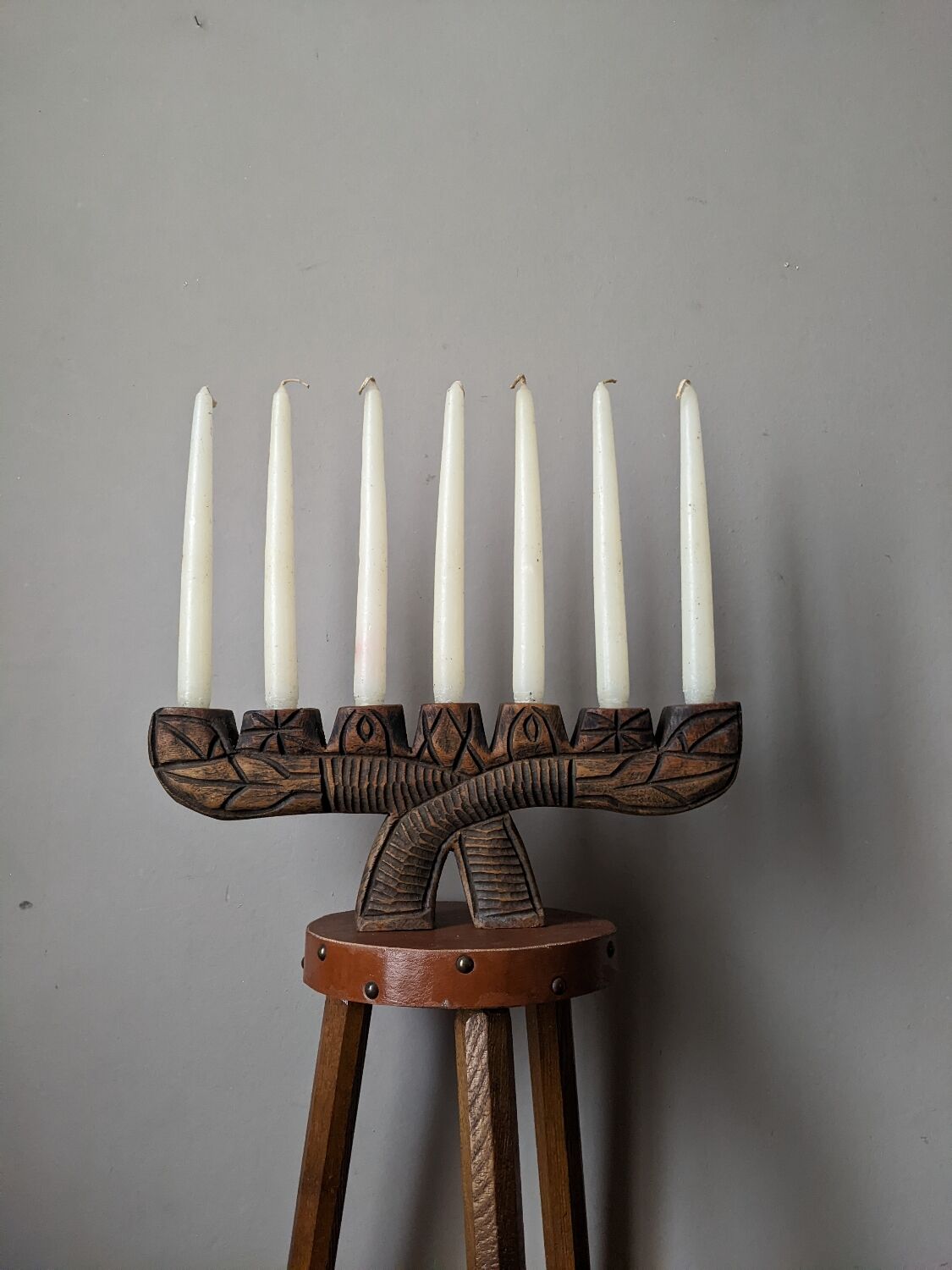 Hand-carved wooden candle holder, ethnic tribal style.