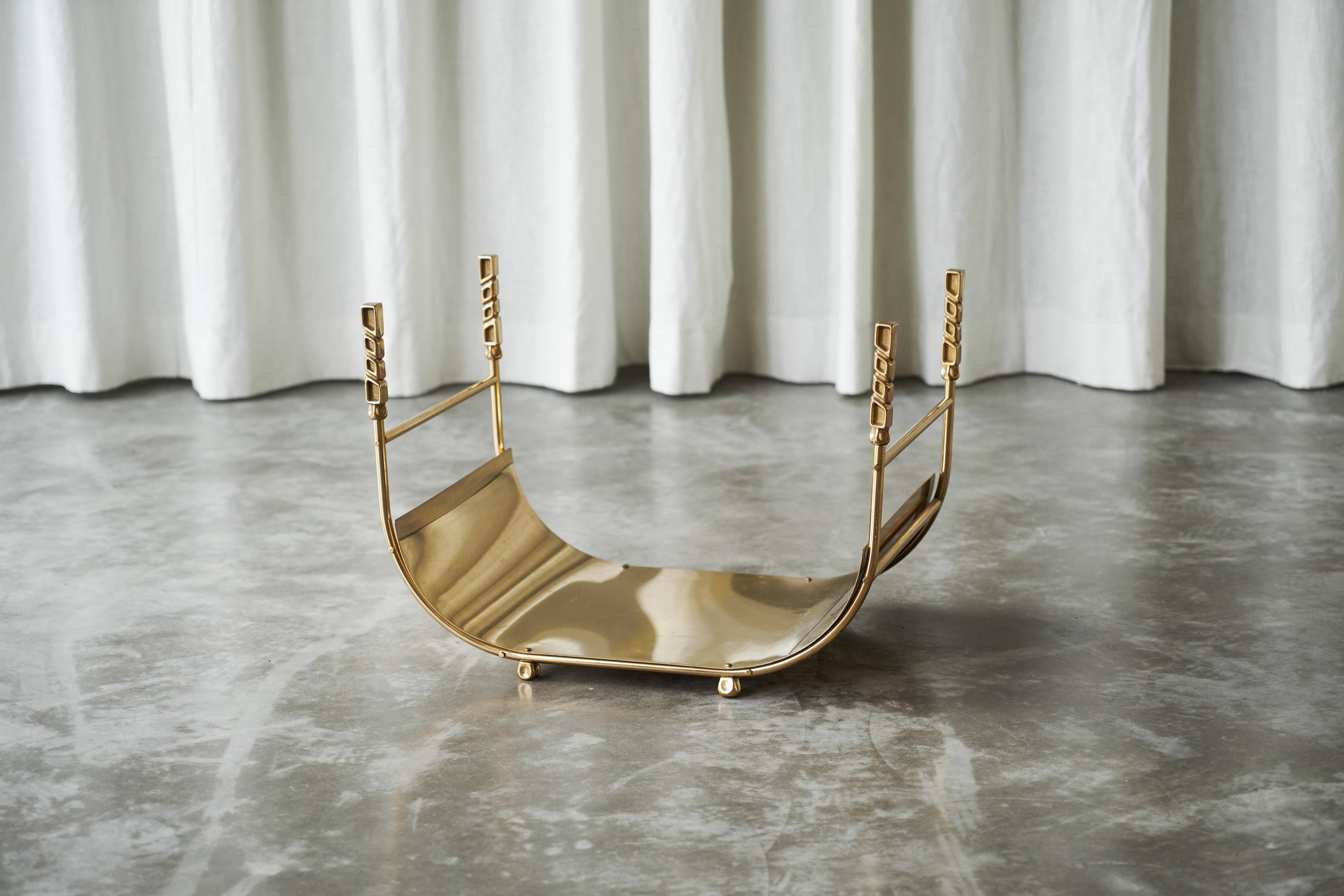 Sculptural brass magazine rack or basket from the 1970s.