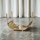 Sculptural brass magazine rack or basket from the 1970s.