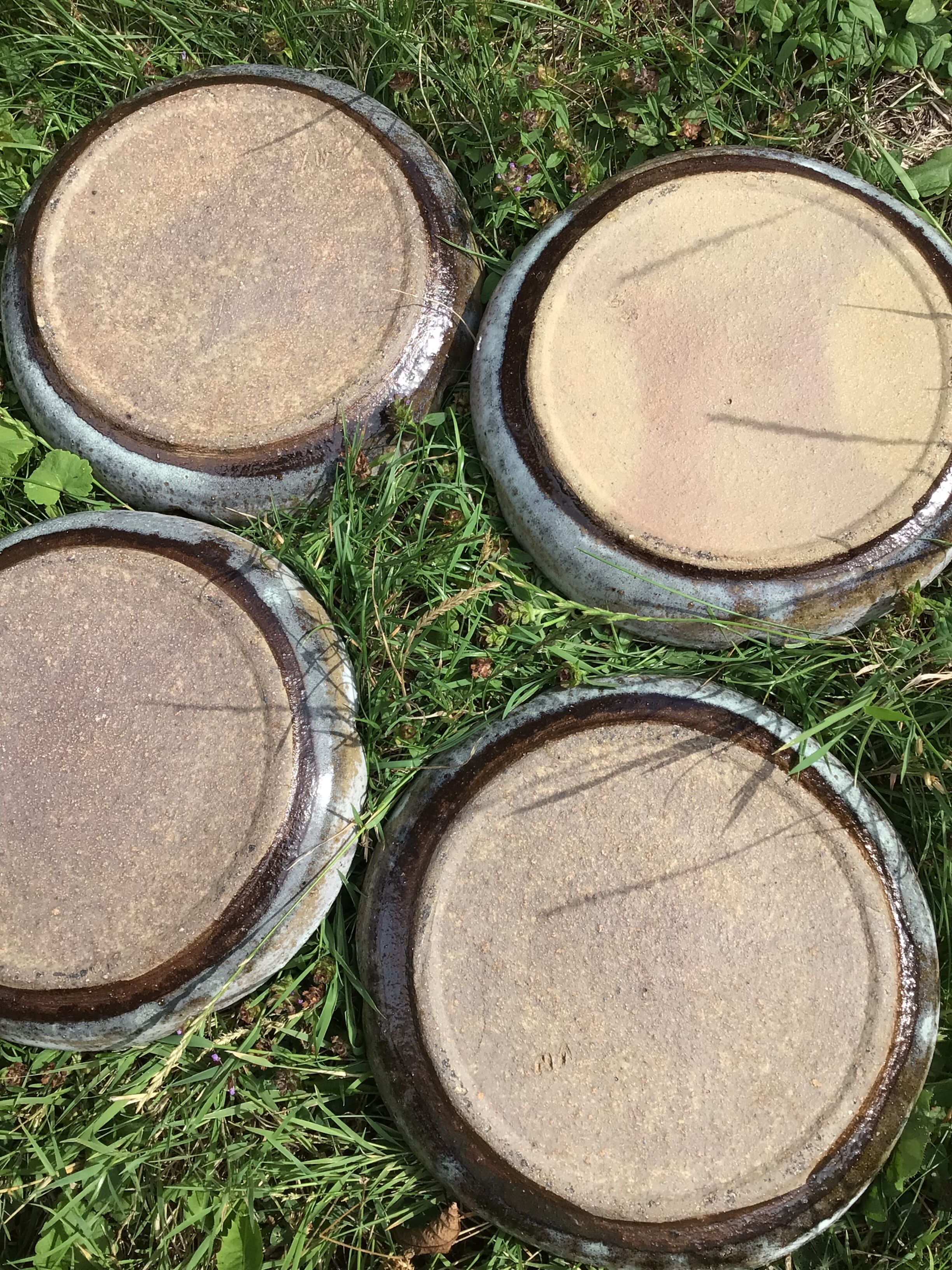 4 White compartmentalized handmade stoneware plates