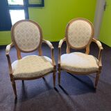 Pair of Louis XVI style armchairs, in solid walnut, re-edged and upholstered, pegged