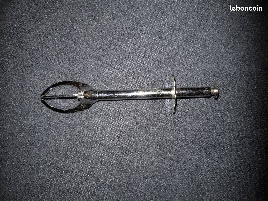 Old sugar tongs with original box.