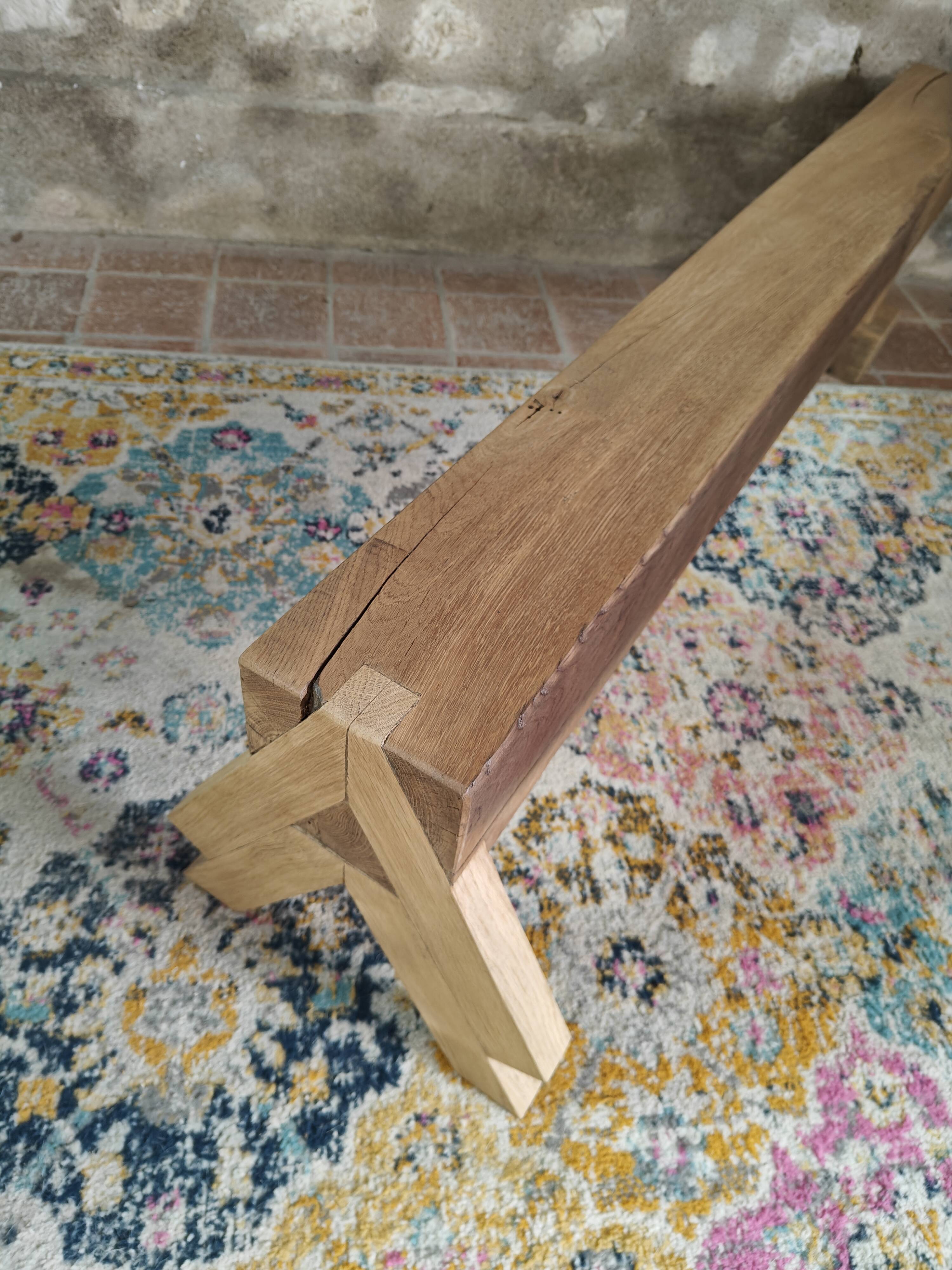 Solid oak bench with asymmetrical legs