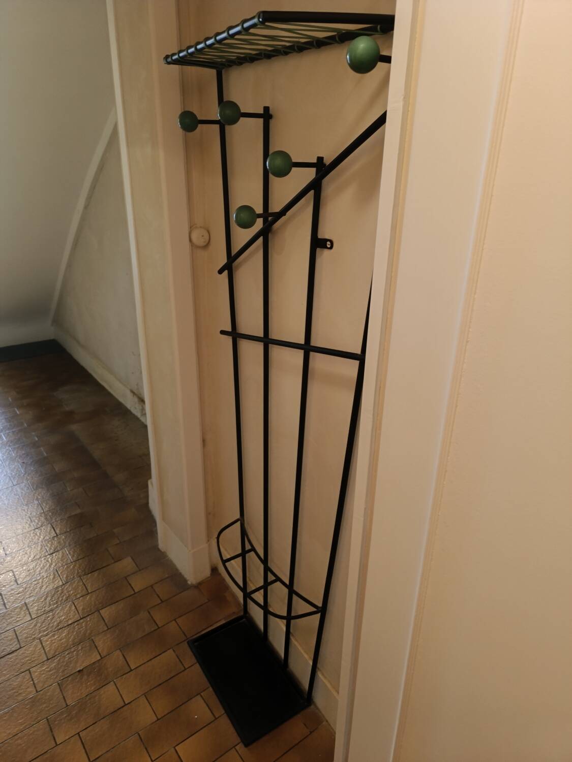 Wall-mounted metal coat rack